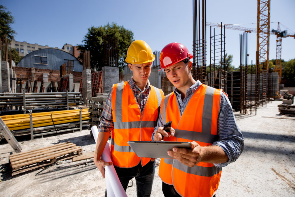 Architect discuss a building project on the tablet